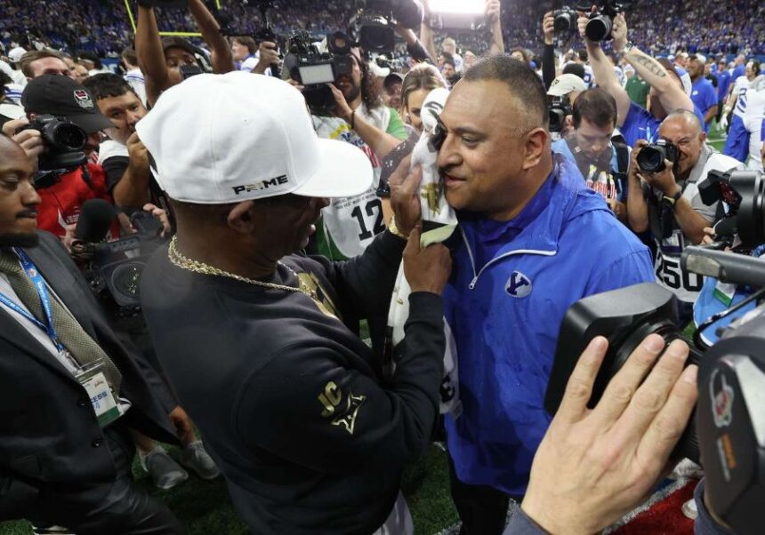 Colorado Buffaloes head coach Deion Sanders wipes gatorade off of Brigham Young Cougars head coach Kalani Sitake after the Valero Alamo Bowl in San Antonio on Saturday, Dec. 28, 2024. BYU won 36-14. (Photo: Jeffrey D. Allred, Deseret News)