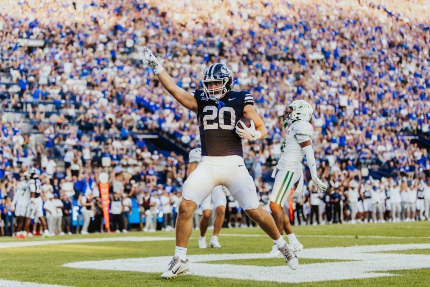 BYU tight end Carsen Ryan celebrates a touchdown during the first half of an NCAA college football game, Saturday, Aug. 30, 2025 at LaVell Edwards Stadium in Provo, Utah. (Photo: Tyler Staten for KSL.com)