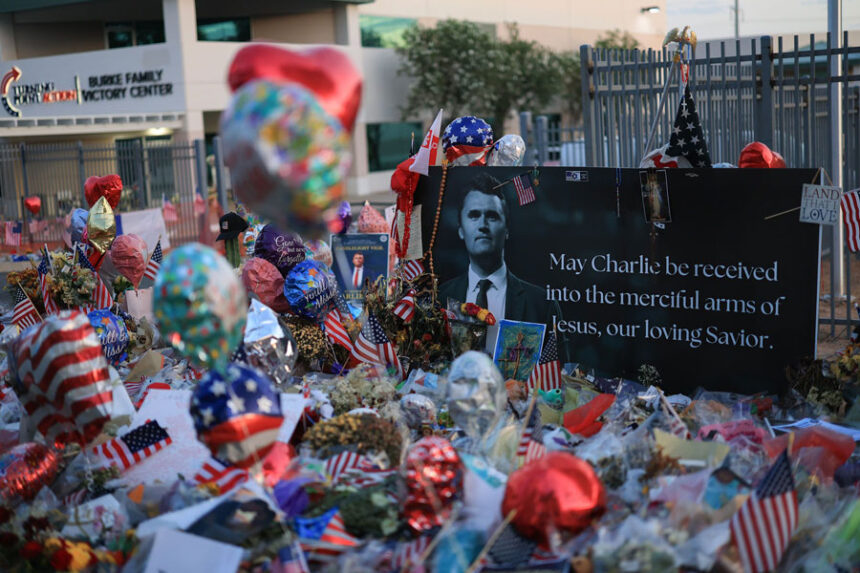 A makeshift memorial is seen for Charlie Kirk outside the headquarters of Turning Point USA on September 17 in Phoenix, Arizona.