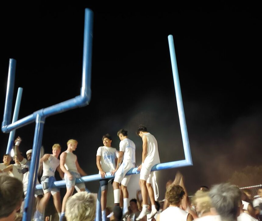 Skyline players celebrate their Emotion Bowl win over Idaho Falls by painting the goal post. | Allan Steele, EastIdahoSports.com.