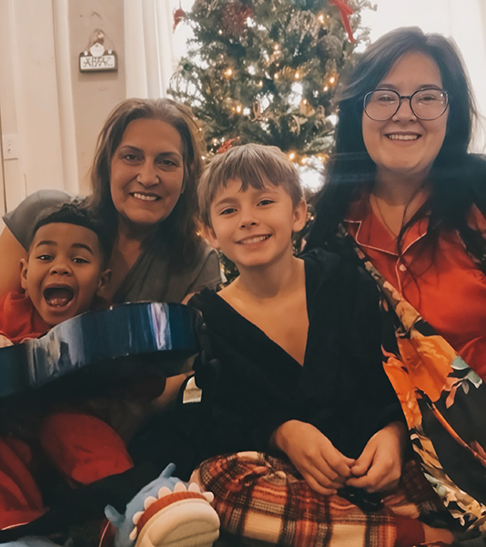 Carter Grover (left) with his grandmother, Laurie Peterson, brother William Grover, and mother, Katherine Grover. | Courtesy of Katherine Grover