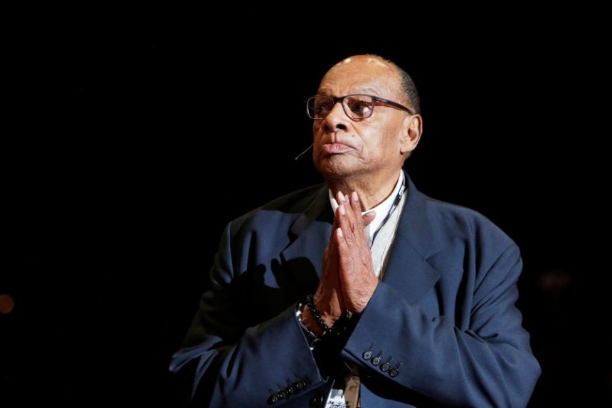 FILE - Former Washington State basketball head coach George Raveling looks on during the school's ceremony to honor him during halftime of an NCAA college basketball game between Washington State and Washington in Pullman, Wash., Feb. 9, 2020. (AP Photo/Young Kwak, file)