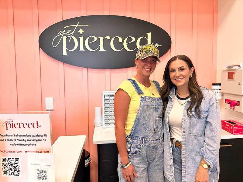 Lorin Parkinson, right, with a customer at Get Pierced Co. in Ammon. | Rett Nelson, EastIdahoNews.com