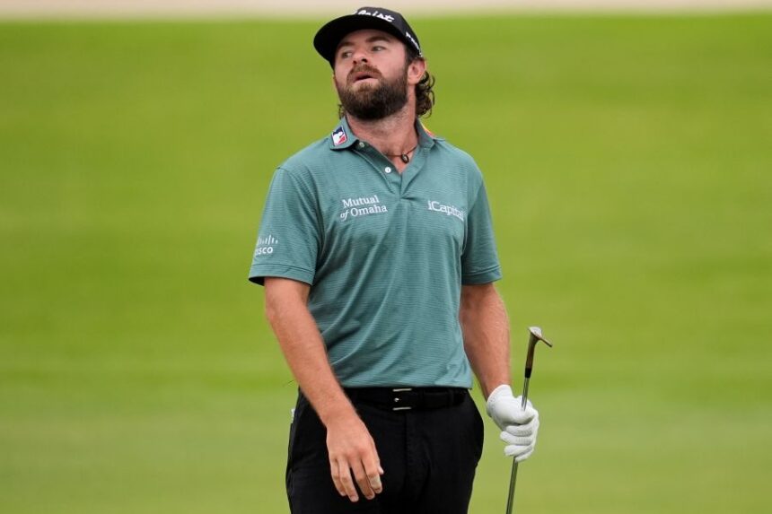Cameron Young reacts to his putt on the 18th green during the third round of the Tour Championship golf tournament, Saturday, Aug. 23, 2025, in Atlanta. (AP Photo/Mike Stewart)