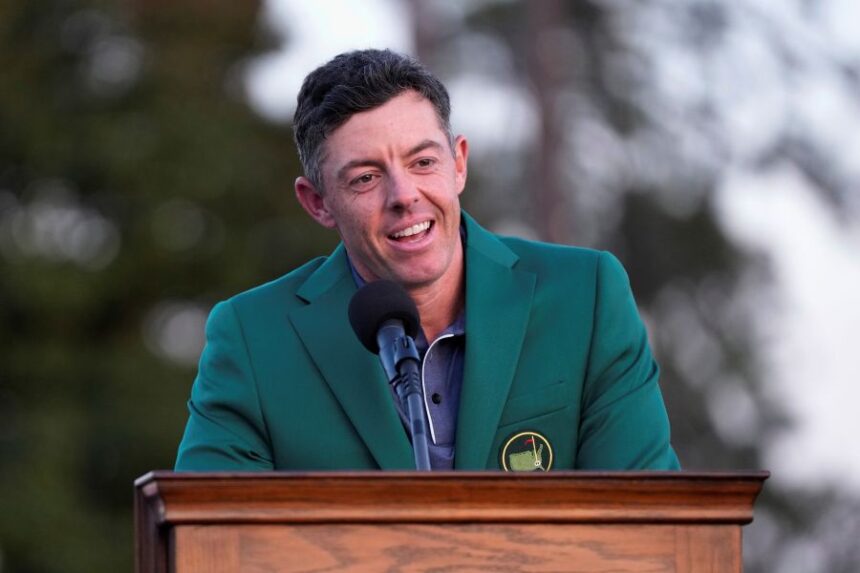 FILE - Rory McIlroy, of Northern Ireland, speaks after putting on the Masters green jacket after winning the Masters golf tournament on April 13, 2025, in Augusta, Ga. (AP Photo/David J. Phillip, File)