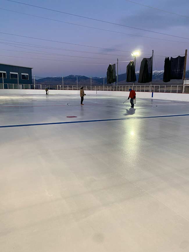 Volunteers prepping the ice at Salmon Hockey Rink | Courtesy Robert Crispin