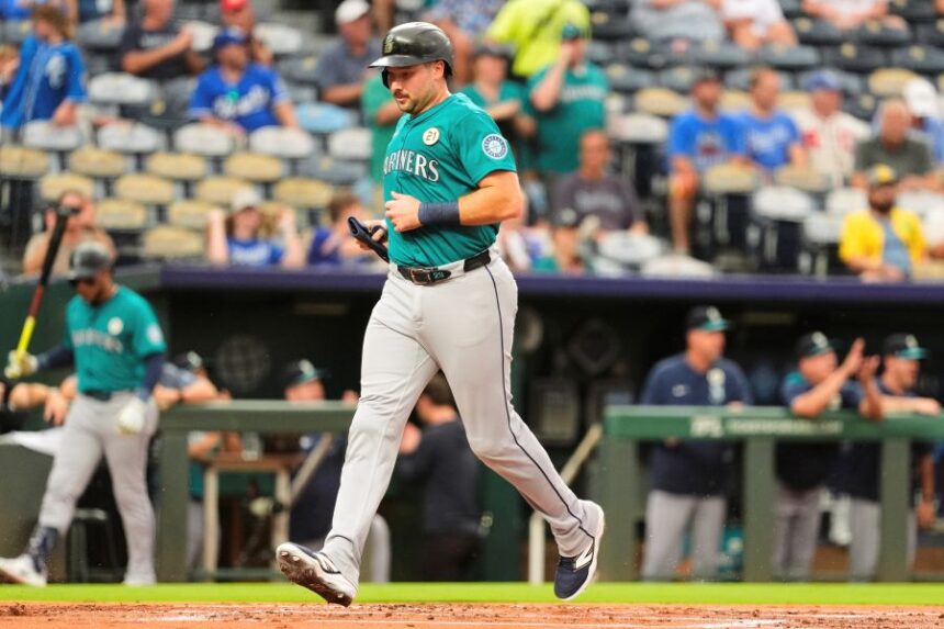 Seattle Mariners' Cal Raleigh runs home to score on a double by Julio Rodriguez during the first inning of a baseball game against the Kansas City Royals, Tuesday, Sept. 16, 2025, in Kansas City, Mo. (AP Photo/Charlie Riedel)
