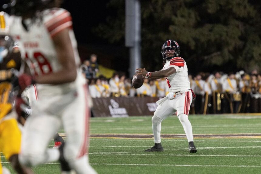 Quarterback Devon Dampier passes the football during the first half of an NCAA college football game, Saturday, Sept. 13, 2025, in Laramie, Wyo. (AP Photo/Matthew Idler)