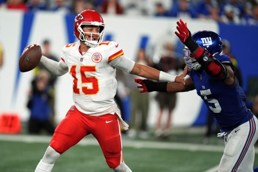 Kansas City Chiefs quarterback Patrick Mahomes throws as New York Giants outside linebacker Kayvon Thibodeaux (5) defends during the second half of an NFL football game Sunday, Sept. 21, 2025, in East Rutherford, N.J. (AP Photo/Seth Wenig)