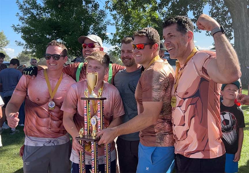 Lyle Dye, right, and the rest of his teammates pose for a photo after winning the spud tug. | Rett Nelson, EastIdahoNews.com