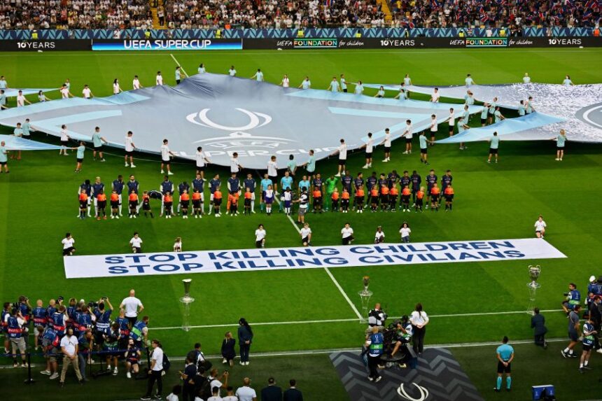 FILE - The players line up before the UEFA Super Cup soccer match between Paris Saint-Germain and Tottenham Hotspur in Udine, Italy, Wednesday, Aug. 13, 2025. (AP Photo/Denes Erdos, File)