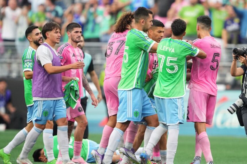 Seattle Sounders midfielder Obed Vargas, bottom left, lies on the ground after being pushed during an altercation against Inter Miami, including forward Luis Suárez and midfielder Sergio Busquets (5) after the Sounders won a Leagues Cup final soccer match Sunday, Aug. 31, 2025, in Seattle. (AP Photo/Lindsey Wasson)
