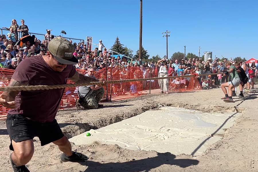 Contestants participate in a tug of war over a pit of mashed potatoes at Shelley Spud Days. | Rett Nelson, EastIdahoNews.com