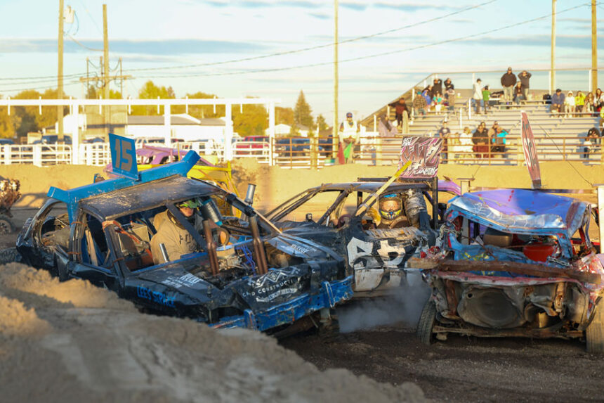 Cache Larsen (“Spaz”) collides with Brikan Archer (#15) during the Mini heat at the 2025 Fall Brawl at the Fremont County Fairgrounds.