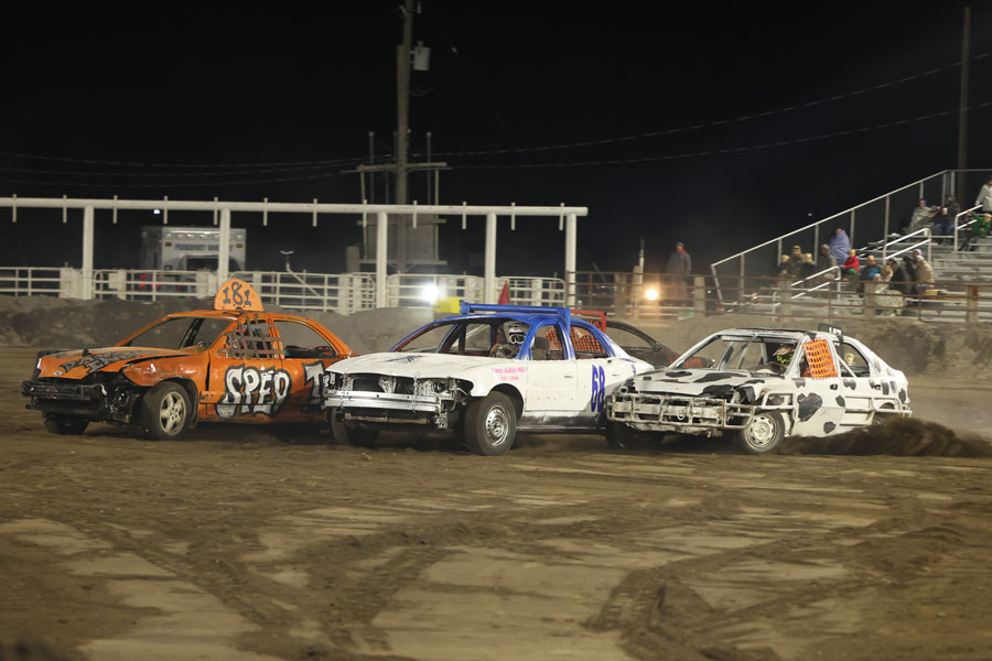 Ted Beasley (181), Gage Van Wagner (68) and Matt Hughes (147) race in the Figure 8 final during the 2025 Fall Brawl at the Fremont County Fairgrounds.