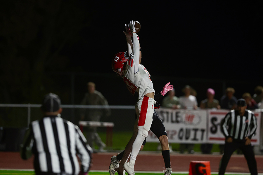 Madison's Baden Wheeler tips a high pass, which is then caught by a Bobcat teammate
