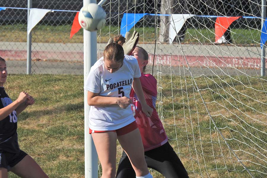 Pocatello girls soccer Claire Schaugaard header to block shot