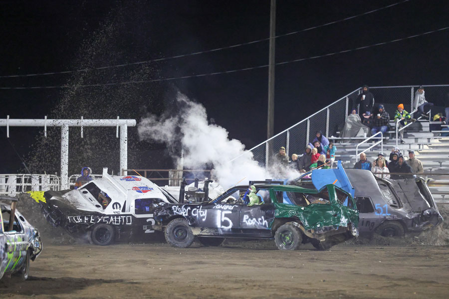 Devin Younger (15) lands a hit on Chance Coffey (245), who became stuck on the track berm during the Old Iron heat at the 2025 Fall Brawl at the Fremont County Fairgrounds.