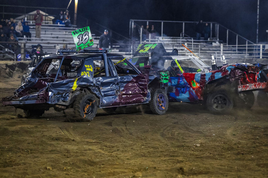 In the Heavy heat at the 2025 Fall Brawl at the Fremont County Fairgrounds, Evan Wade (18) hits Cade Adakai (31).