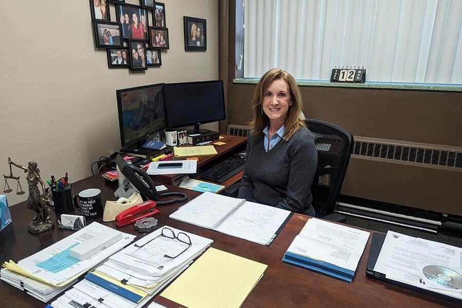Erin Tognetti at desk