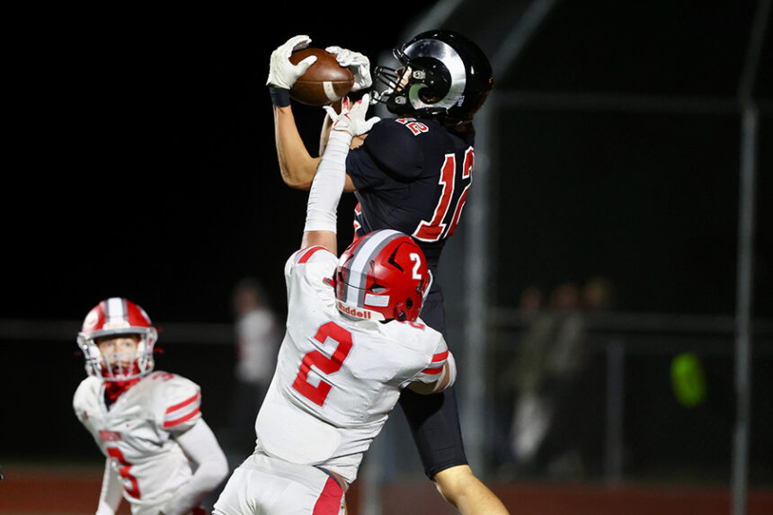 Highland's Kona Baldwin snatches a jump-ball touchdown in the final seconds of the first half.