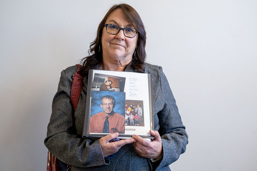 Rhonda D’Amico holding a folder of photos of her late husband, Eric D'Amico, and her victim impact statement. | Daniel V. Ramirez, EastIdahoNews.com