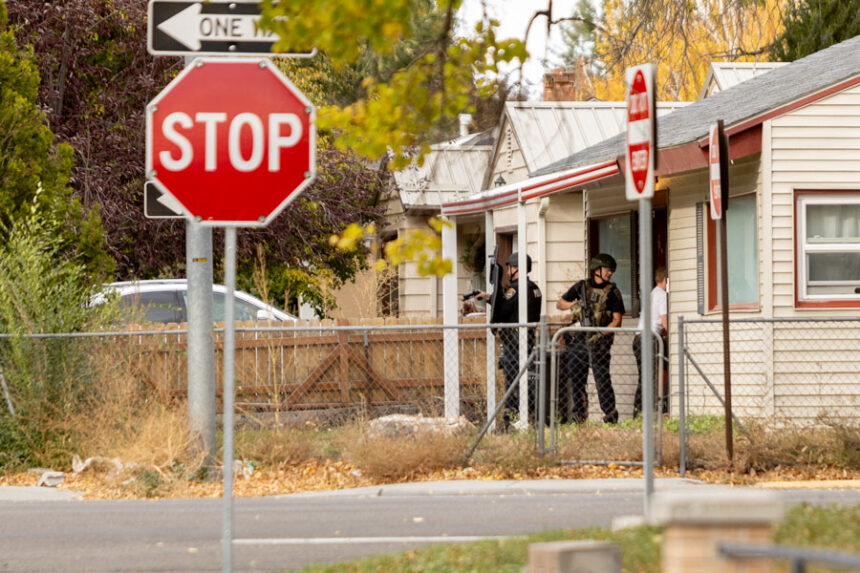 Idaho Falls Police Officers advising neighboors to shelter-in-place during standoff on Lomax Street and Wabash Avenue Monday Evening. | Daniel V. Ramirez, EastIdahoNews.com