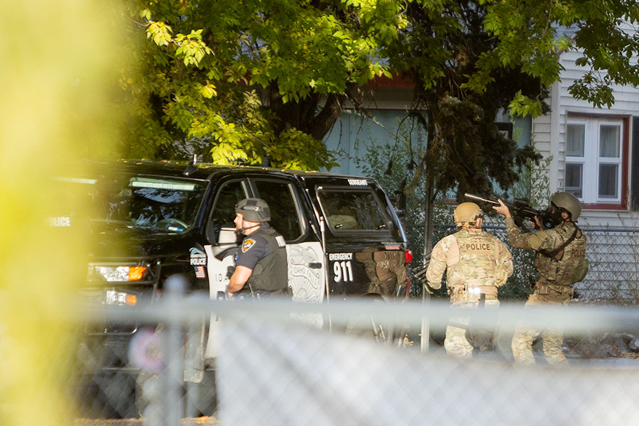 Officers with Idaho Falls Police Department's SWAT Team pointing their guns at the residence while tear gas was being deployed. | Daniel V. Ramirez, EastIdahoNews.com