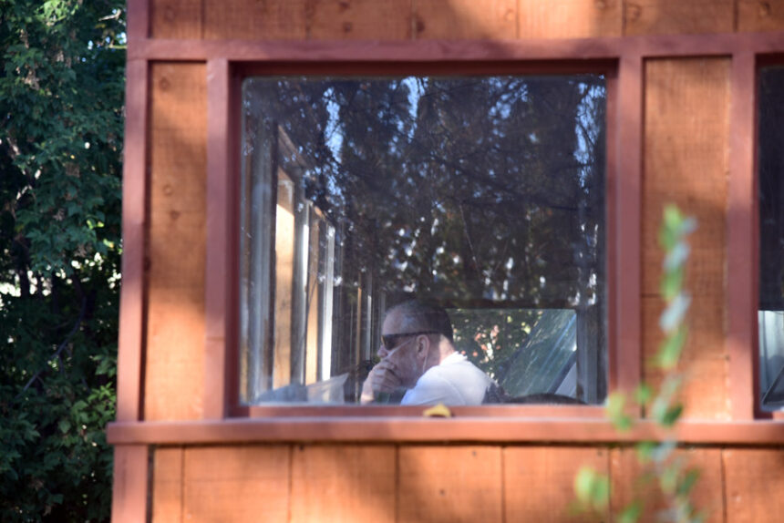 Perry watching as Right Now Heating & Air installs his new, donated furnace. | Kaitlyn Hart, EastIdahoNews.com