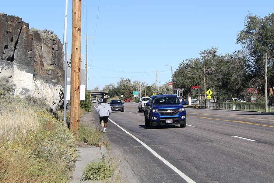 Onyedika Anih jogging north on South Fifth Avenue.
