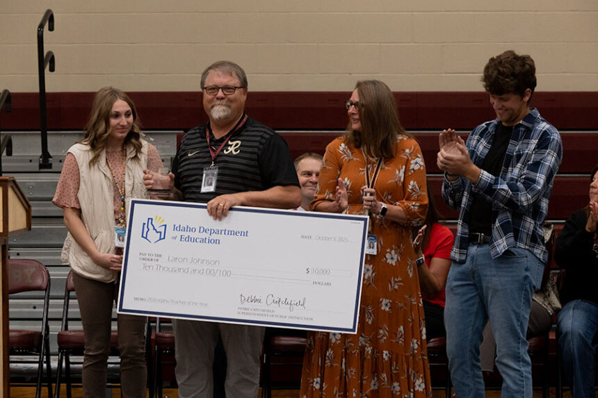 Teacher and Idaho's 2025 Teacher of the Year Laron Johnson surrounded by his family at Rigby High School. | Daniel V. Ramirez, EastIdahoNews.com