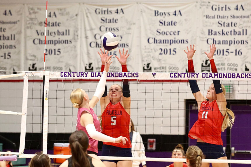 Century volleyball Peyton Burrup attacks the Pocatello volleyball block of Hallee Peterson (5) and Maeve Rollins (11)