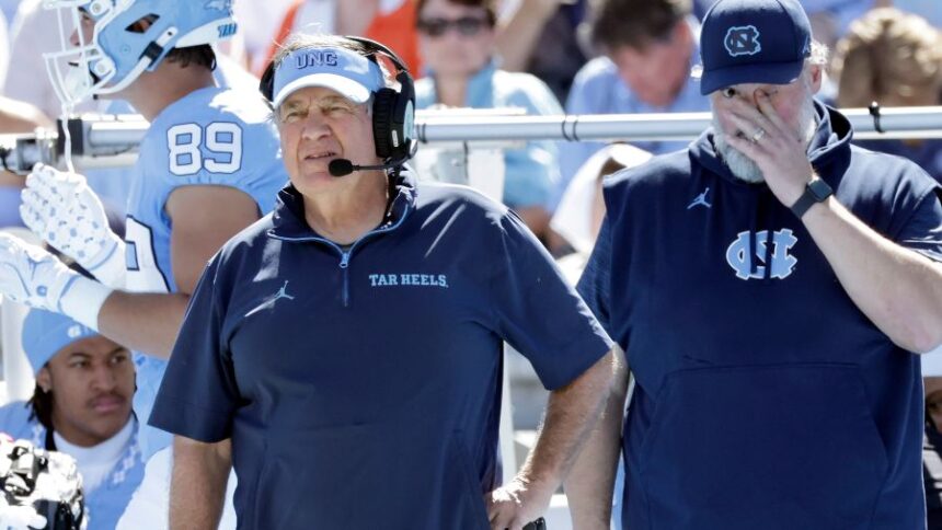 North Carolina head coach Bill Belichick, left, watches during the first half of an NCAA college football game against Clemson, Saturday, Oct. 4, 2025, in Chapel Hill, N.C. (AP Photo/Chris Seward)