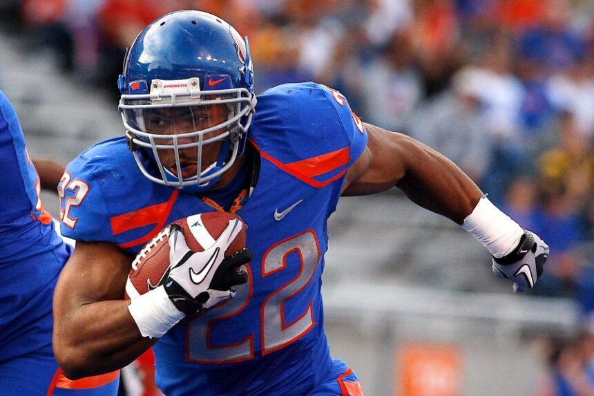 FILE - Boise State's doug Martin runs for a first down during the first half of the NCAA college football game against Toledo, Saturday, Oct. 9, 2010 in Boise, Idaho. (AP Photo/Matt Cilley, File)