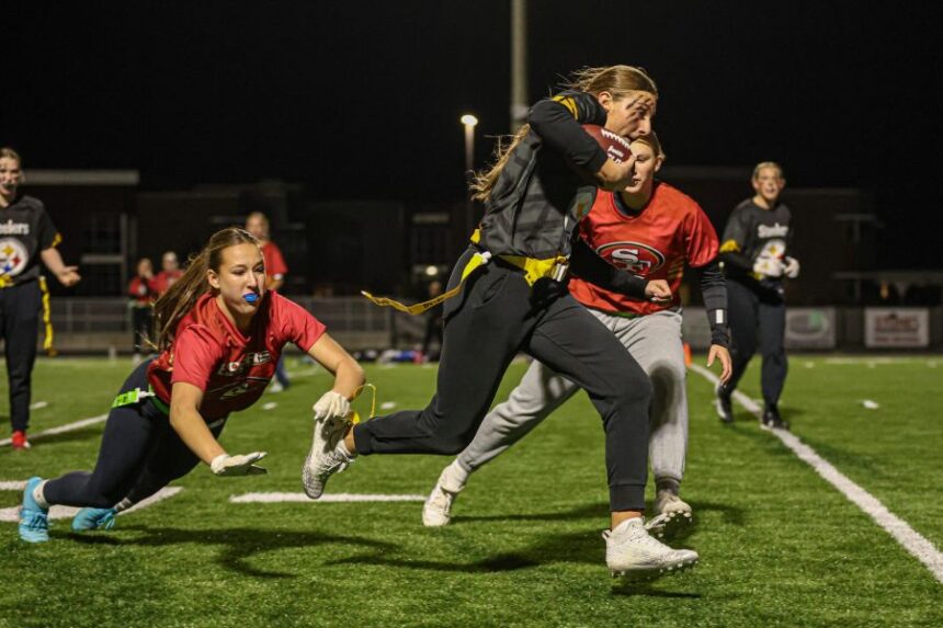 Thunder Ridge defender Mia Taylor dives to capture the flag of Rigby's Breleigh Youngstrom as Thunder Ridge's Ashton Dabell closes in. | Courtesy Heidi Freeman.