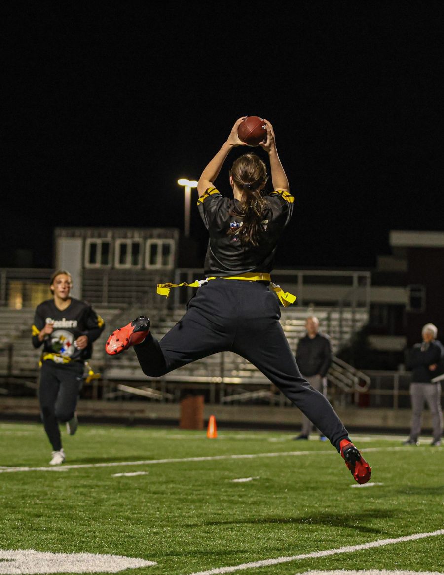 Rigby's Brinley Larsen leaps for a catch during Monday's game. | Courtesy Heidi Freeman.