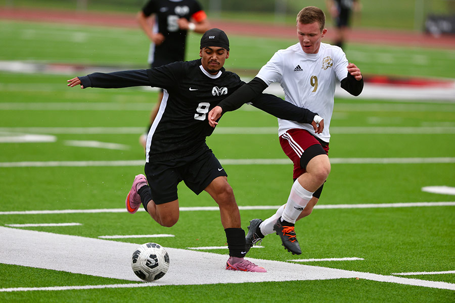 Highland boys soccer Martin Robles-aleman races Rigby boys soccer Eldon Simmons for possession