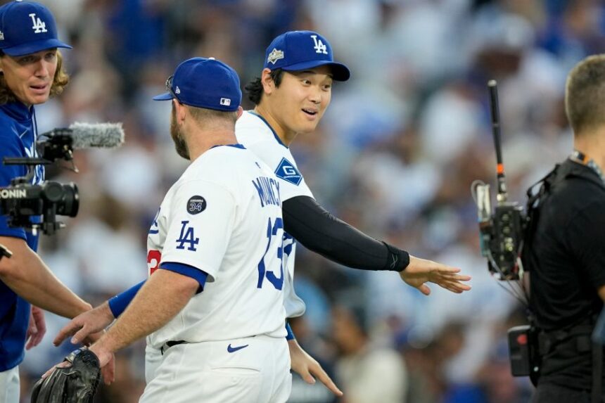 Los Angeles Dodgers' Shohei Ohtani celebrates their win against the Milwaukee Brewers in Game 3 of baseball's National League Championship Series, Thursday, Oct. 16, 2025, in Los Angeles. (AP Photo/Brynn Anderson)