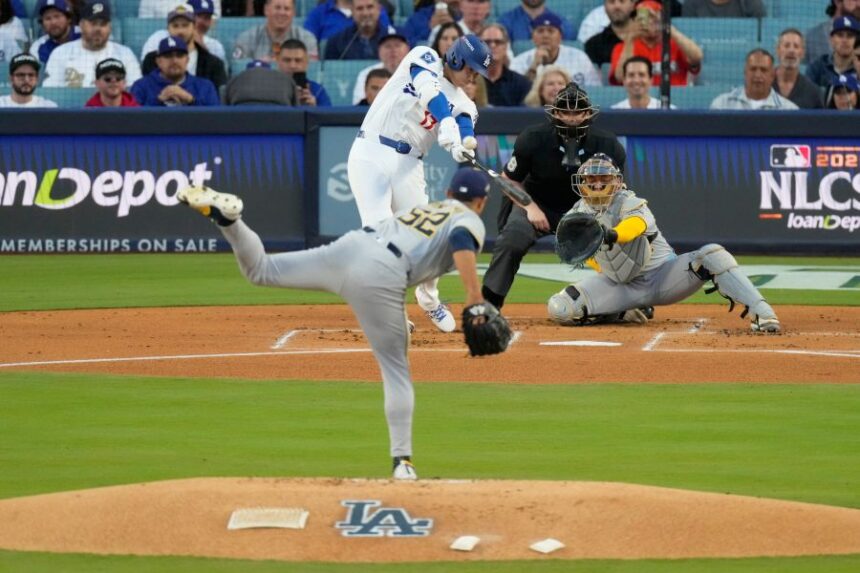Los Angeles Dodgers' Shohei Ohtani hits a home run against the Milwaukee Brewers during the first inning in Game 4 of baseball's National League Championship Series, Friday, Oct. 17, 2025, in Los Angeles. (AP Photo/Mark J. Terrill)