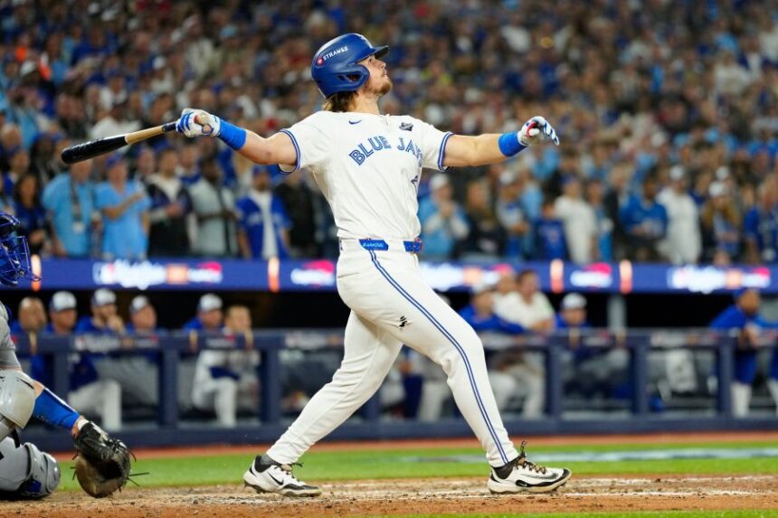 Toronto Blue Jays' Addison Barger watches his grand slam against the Los Angeles Dodgers during the sixth inning of Game 1 of baseball's World Series in Toronto, Friday, Oct. 24, 2025. (Frank Gunn/The Canadian Press via AP)