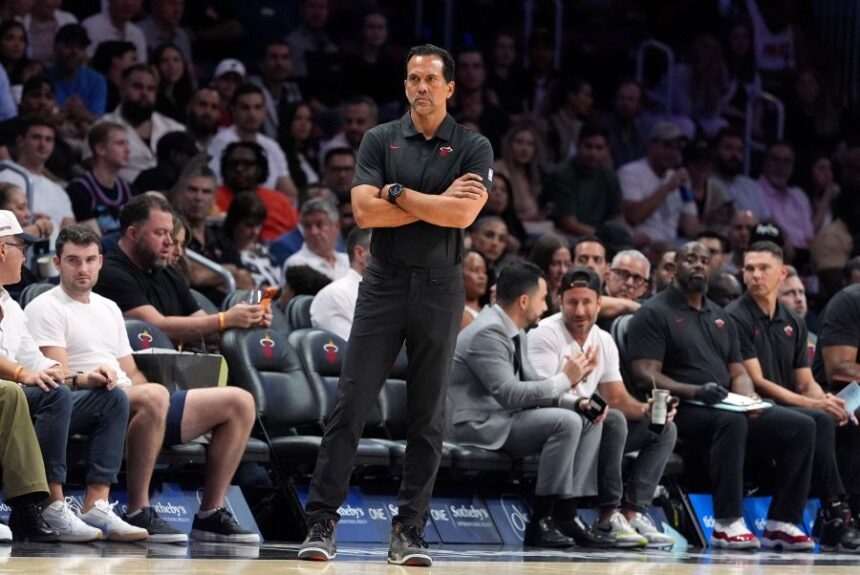 Miami Heat head coach Erik Spoelstra watches from courtside during the first half of a preseason NBA basketball game against the San Antonio Spurs, Wednesday, Oct. 8, 2025, in Miami. (AP Photo/Rebecca Blackwell)