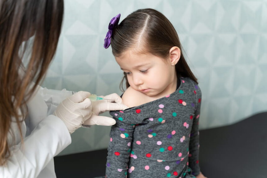 pediatrician vaccinating little patient