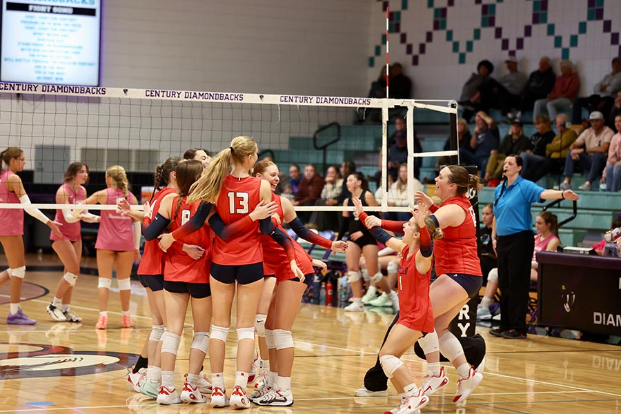 Pocatello volleyball celebrates a district tournament victory over Century volleyball