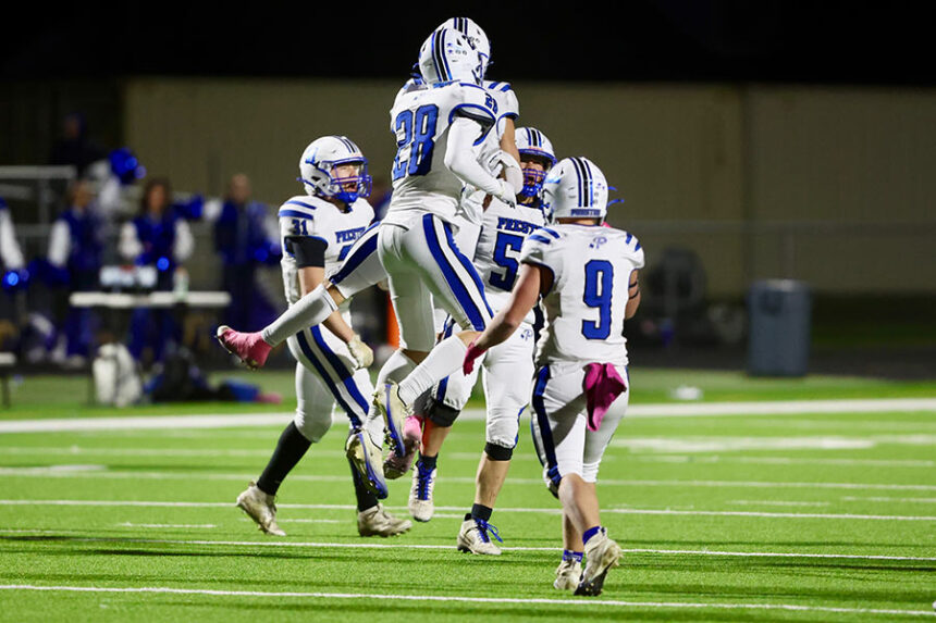 Preston football defense celebrates a fourth-down sack against Poky