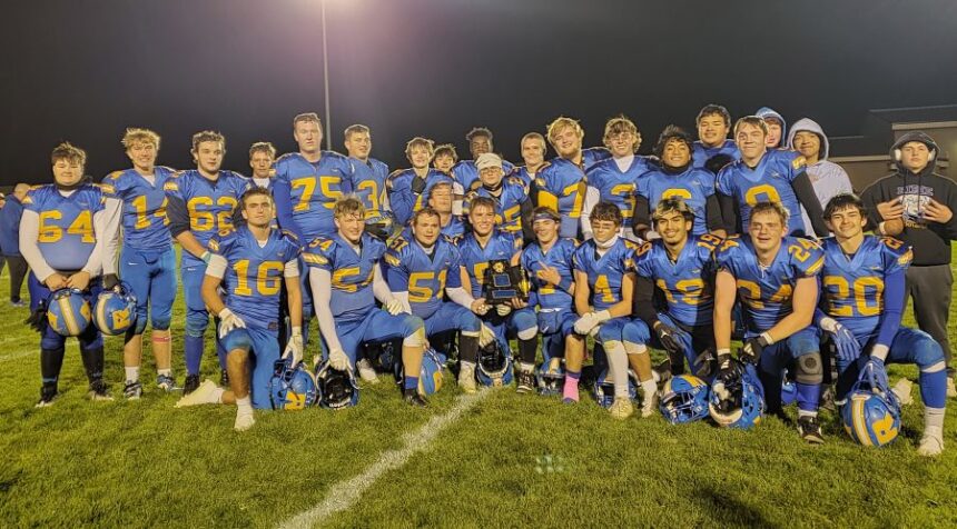 The Ririe football team with its conference trophy. | Allan Steele, EastIdahoSports.com.