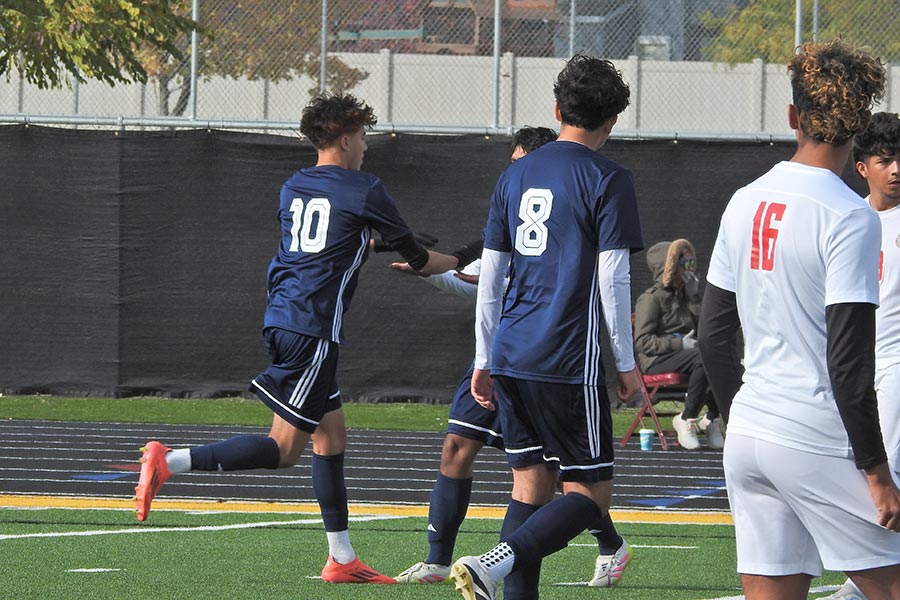Skyline boys soccer Santino Antrim celebrate his PK score