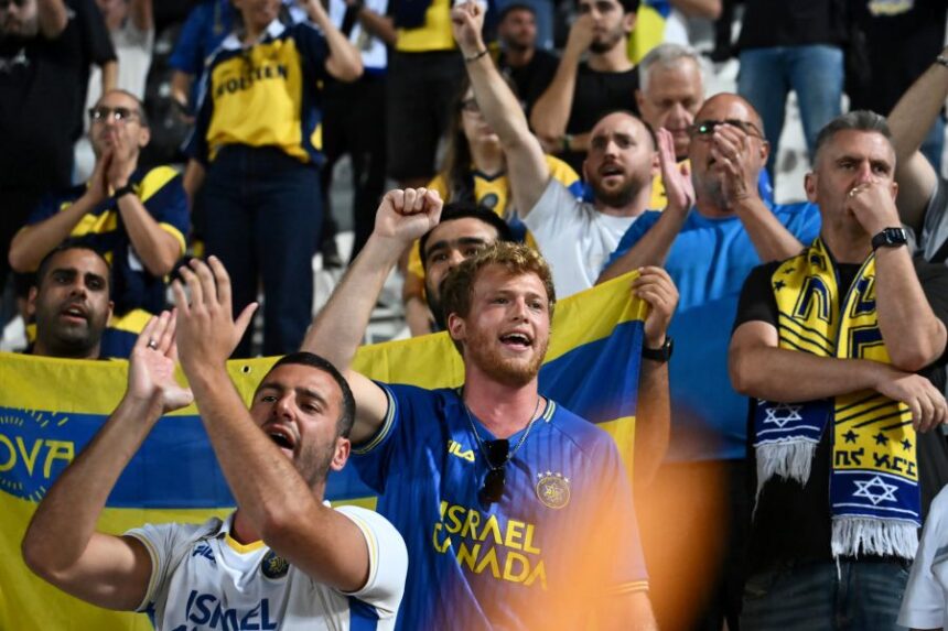 FILE -Maccabi Tel Aviv's fans clap hands after the end of the Europa League soccer match between PAOK and Maccabi Tel Aviv at Toumpa stadium, in Thessaloniki, Greece, Sept. 24, 2025. (AP Photo/Giannis Papanikos, File)