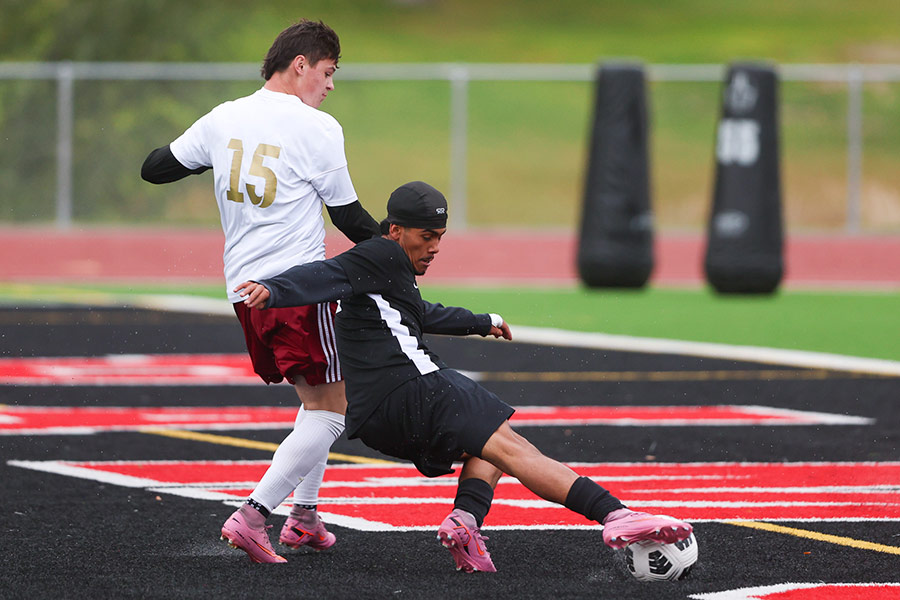 Highland boys soccer Rigby boys soccer Martin Robles-Aleman tries to get past Kian Wilford