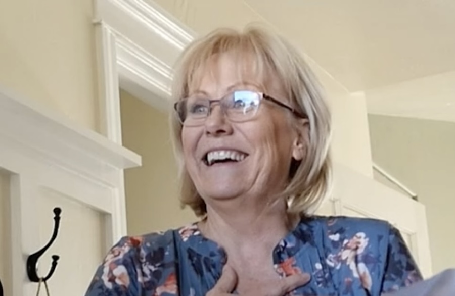 A Secret Santa surprises a beloved piano teacher with the instrument of her dreams