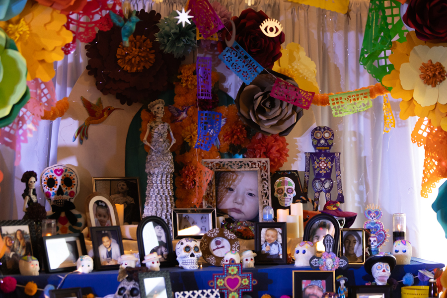 Dozens of photos of passed loved ones placed throughout the altar with gifts of water, pan de muertos and other items. | Daniel V. Ramirez, EastIdahoNews.com